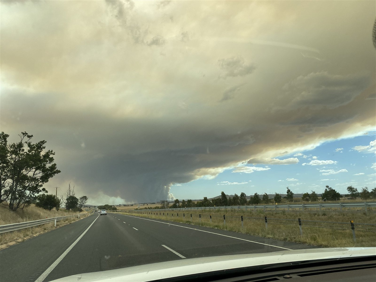 A smoky sky above a road