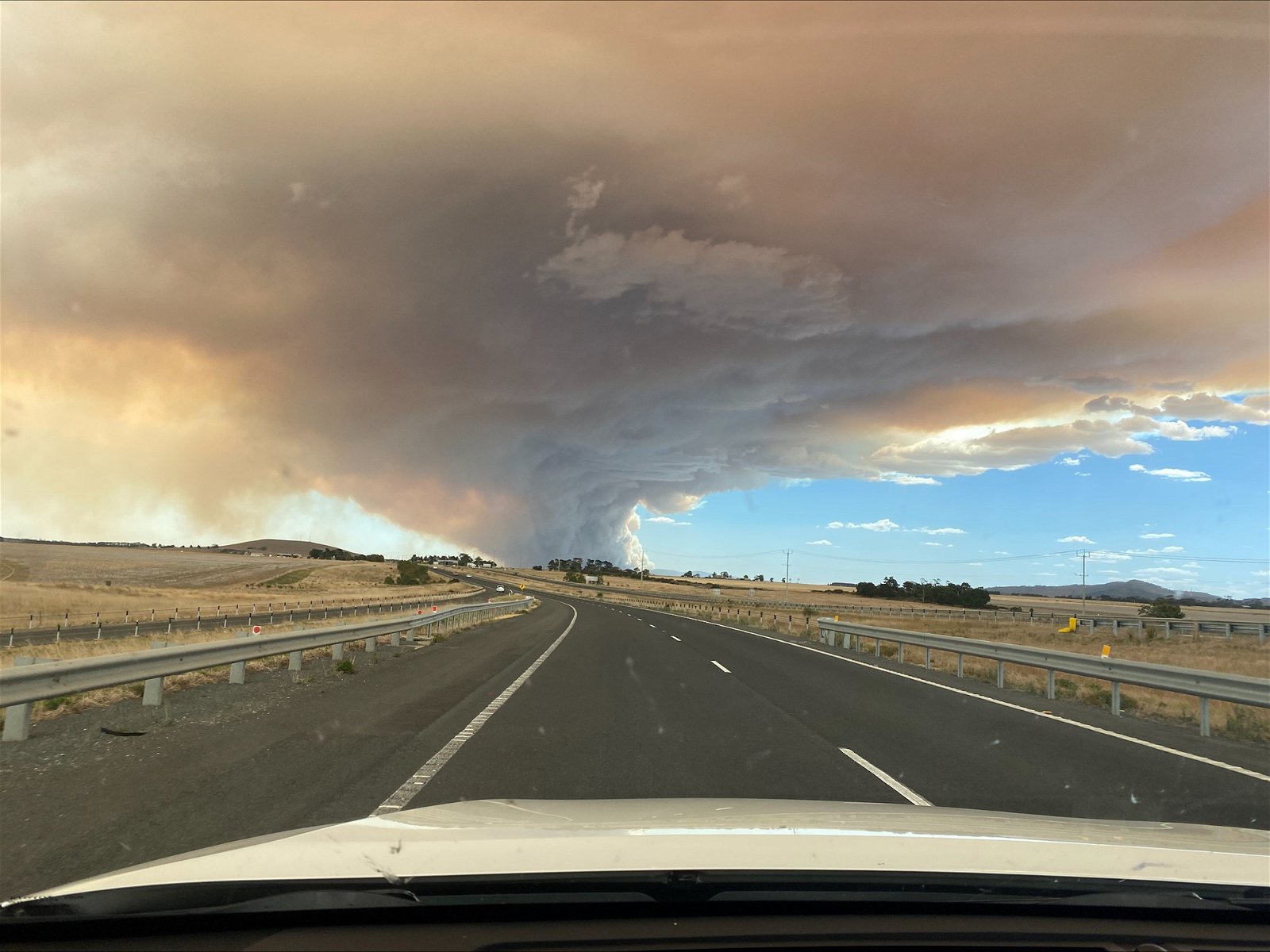 A smoky sky above a road